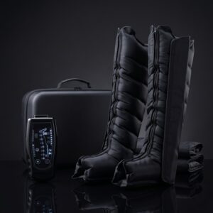 Pneuva air-compression recovery boots and handheld controller on dark studio background